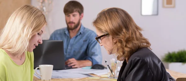 Two female designers discussing