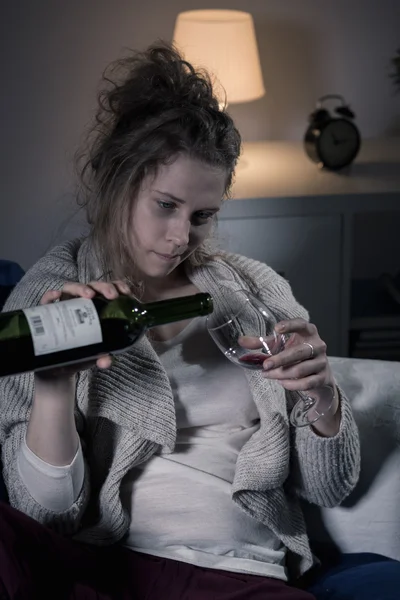 Woman drinking alone