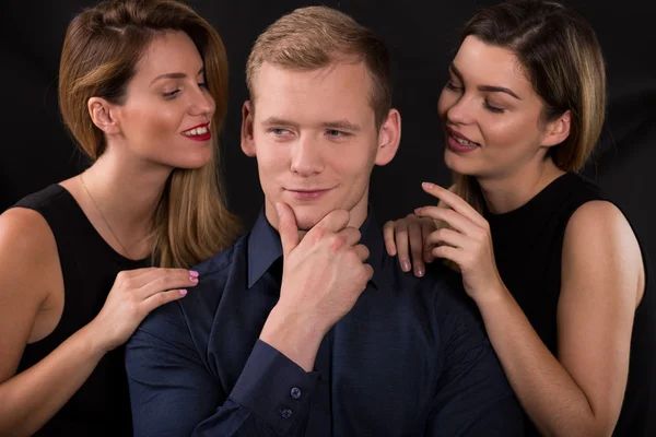 Alluring women seducing narcissistic man