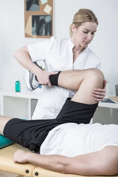 Female physiotherapist working with patient