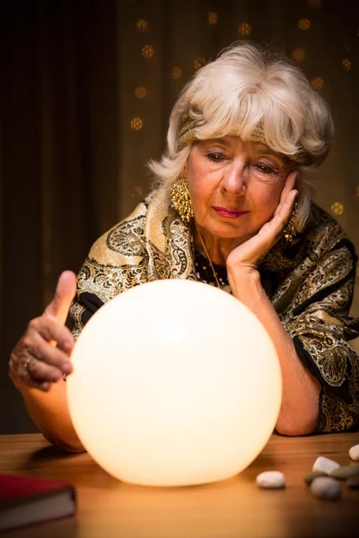 Fortune teller with crystal ball