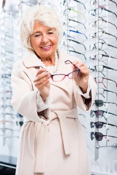 Senior woman in optical shop