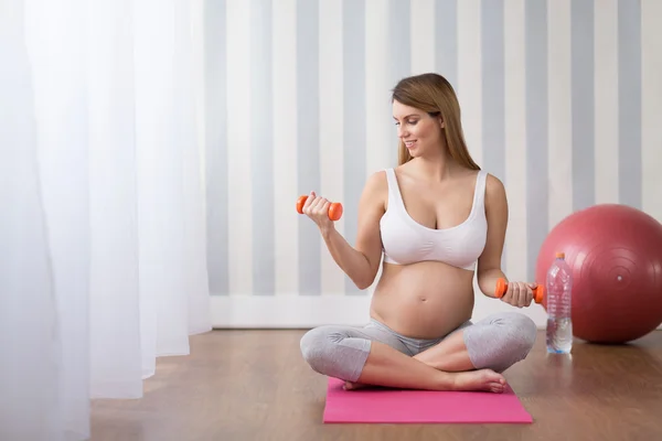 Woman during pregnancy workout