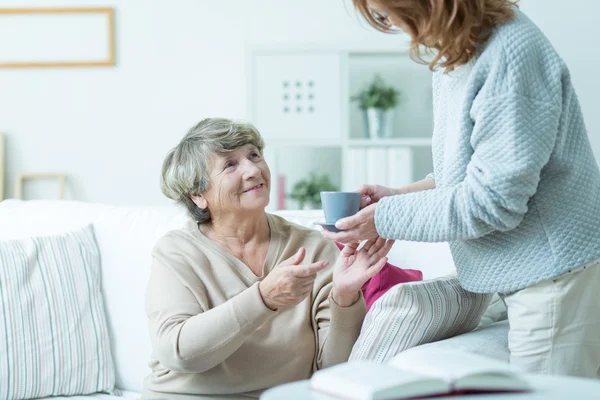 Daughter caring about elder mother