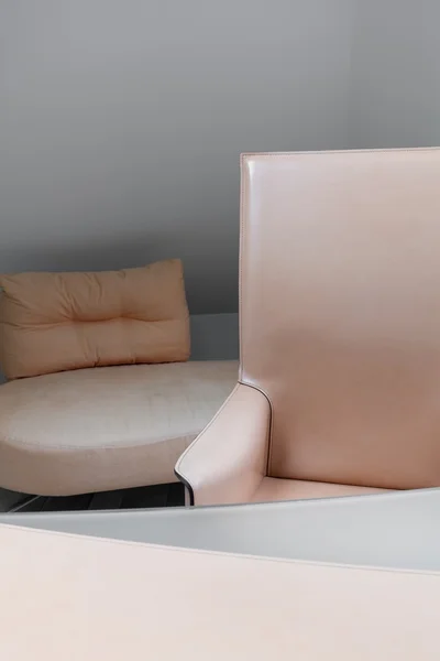 Stylish beige leather armchair