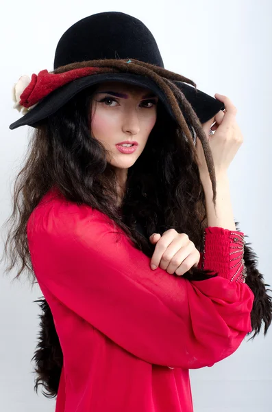 Beautiful girl in hat and with fur