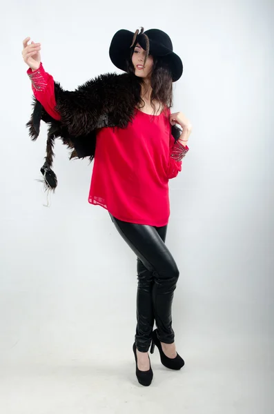 Beautiful girl in hat and with fur