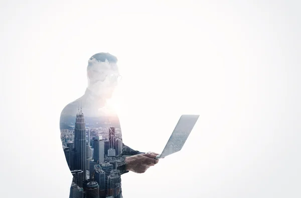 Double exposure bearded businessman wearing black shirt and glasses.Banker holding contemporary notebook hands.Work online banking.Isolated white,modern skyscraper city background.Horizontal mockup