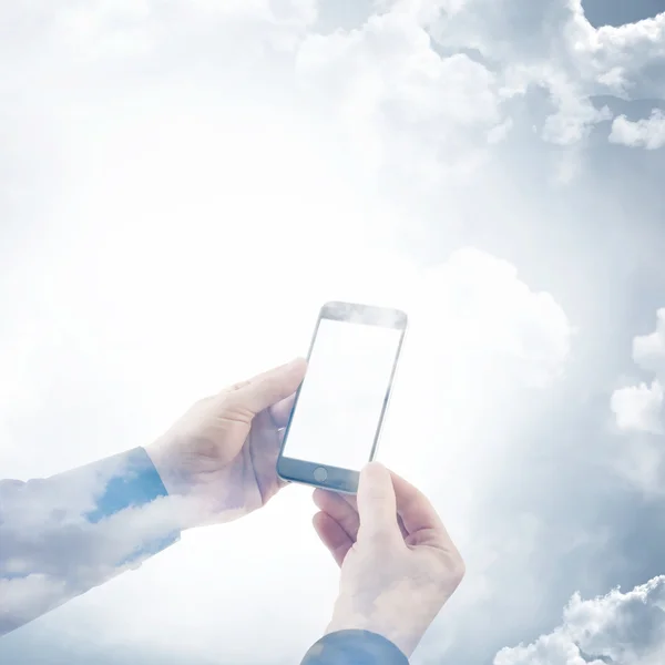 Double exposure photo businessman holding modern smartphone hands. Reflection of clouds background, white blank screen ready for your business information. Square mockup.