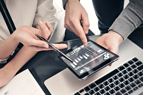 Investment department work process.Closeup photo man showing reports modern tablet screen.Statistics graphics screen.Private banker manager holding pen for signs documents.New business project startup