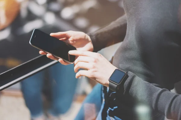 Picture Woman Working Modern Studio,Wearing Generic Design Smart Watch Hand.Female Finger Touching Empty Screen Mobile Phone.Timeline Management. Horizontal mockup. Burred background. Film effect