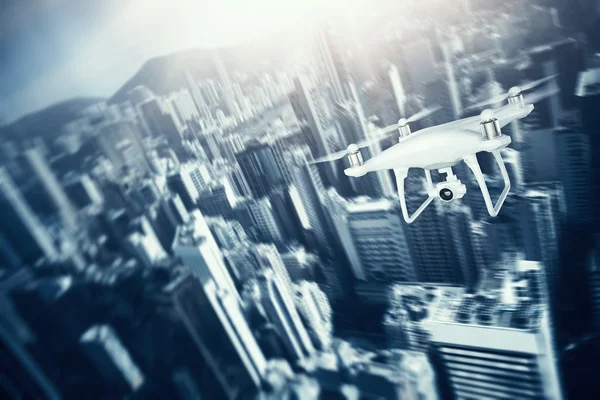 Photo White Matte Generic Design Remote Control Air Drone with action camera Flying Sky under City. Modern Megapolis Background. Horizontal, front side view. Motion Blur Effect. 3D rendering.