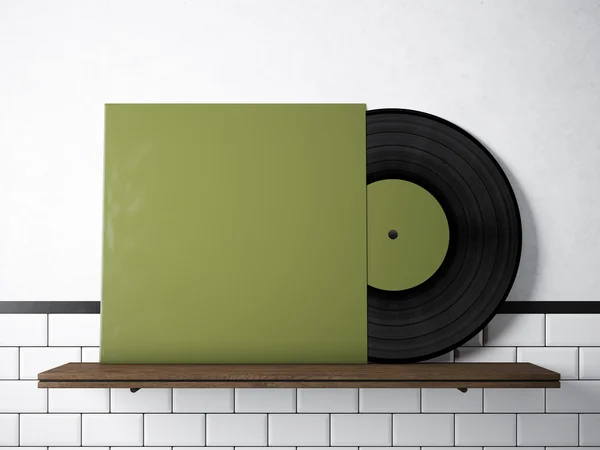 Photo vinyl music album template on natural wood bookshelf.White painted bricks wall background.Vintage style,high textured row materials.Green blank disk cover. Horizontal. 3D rendering.
