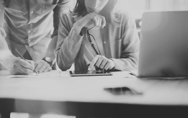 Sales Managers Working Modern Loft.Woman Showing Market Report Digital Tablet.Producer Department Work New Startup Project.Researching Process Wood Table.Horizontal.Blurred.Black White.