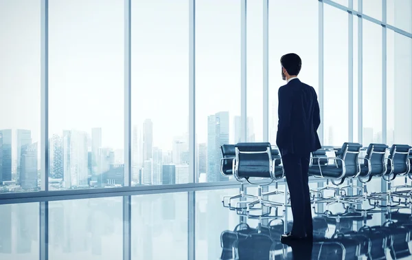 Businessman standing in modern office