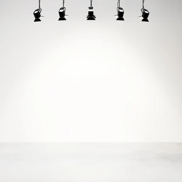 White studio background with spotlights