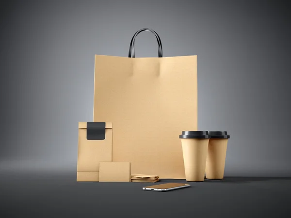 Set of brown pocket bag, two coffee cups, business cards and generic design smartphone. Black background. 3d render
