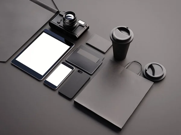 Closeup of generic design office elements on the black background. 3d render