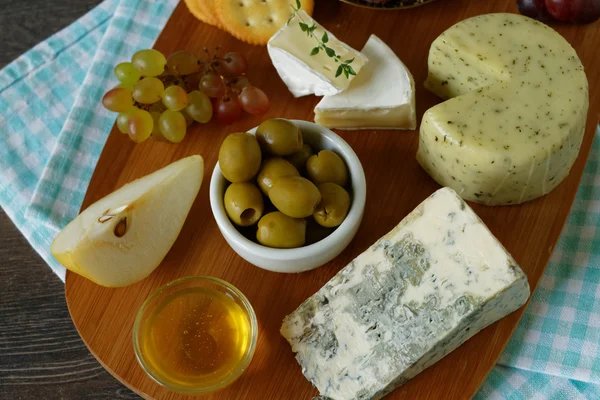 Autumn appetizer with cheese and fruits