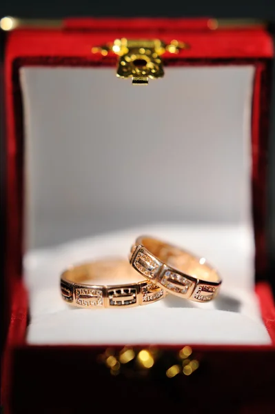 Pair of gold wedding rings in the box