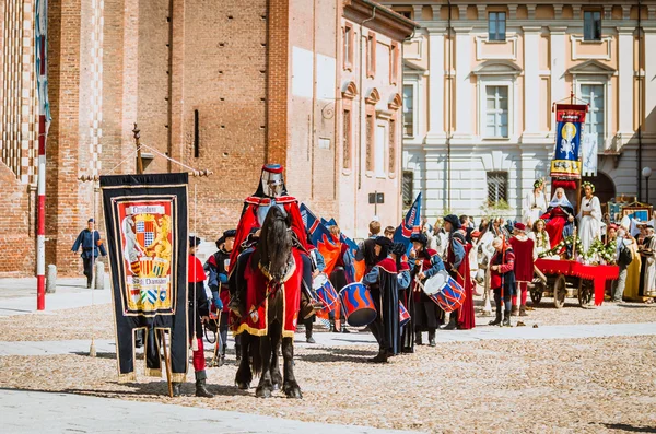 Knight on black horse in medieval  parade