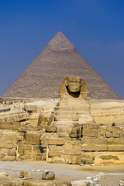 Great sphinx with the pyramid in the background in Giza, Egypt