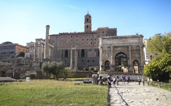 Tourists visit Italy via Fori Imperiali in Rome