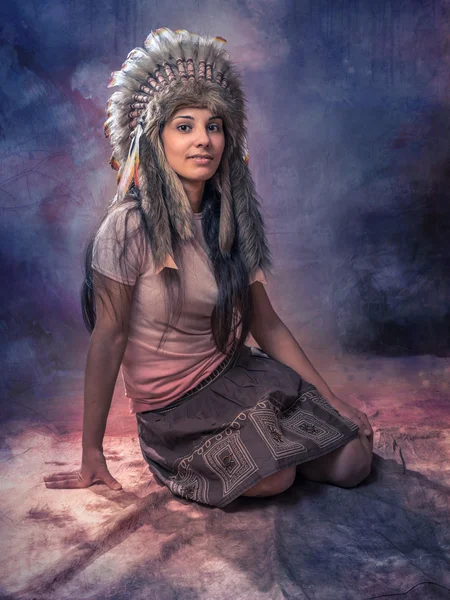 Indian girl. The headpiece of eagle feathers. Roach.