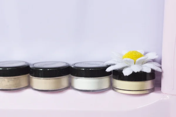 Chamomile handmade mineral cosmetics. artificial flower and natural cosmetics.