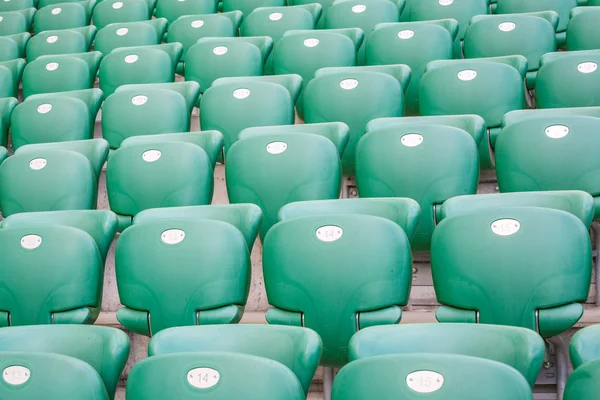 Green plastic seats  at modern stadium