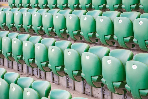 Green plastic seats  at modern stadium