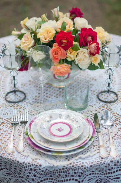 Bouquet of flowers and a table sat on the white tablecloths