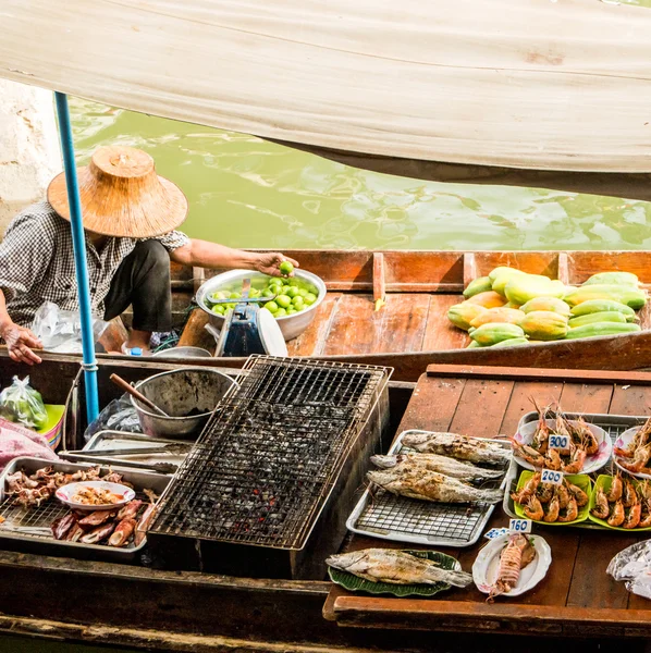 Traders boats in a floating market in Thailand.