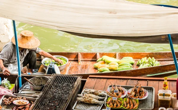 Traders boats in a floating market in Thailand.
