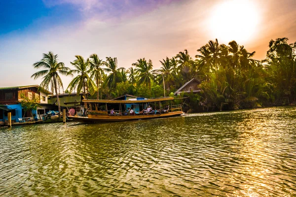 Stilt houses above river in rural Thailand.