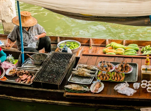 Traders boats in a floating market in Thailand.
