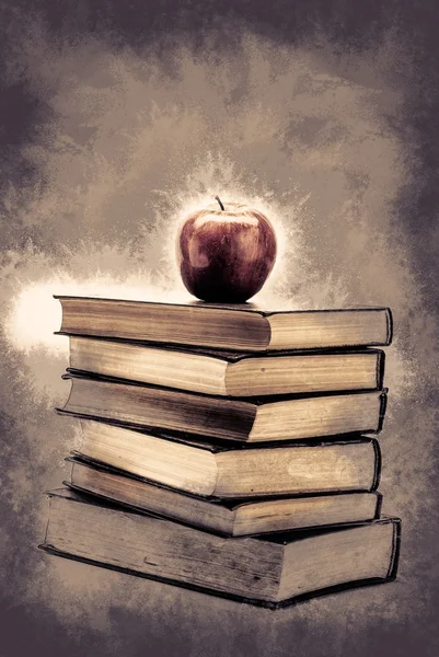 Stack of Old Books With an Apple on Top