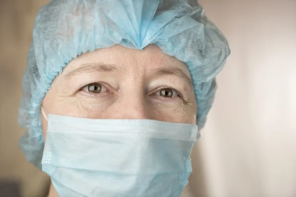 Smiling female doctor in hospital hallway