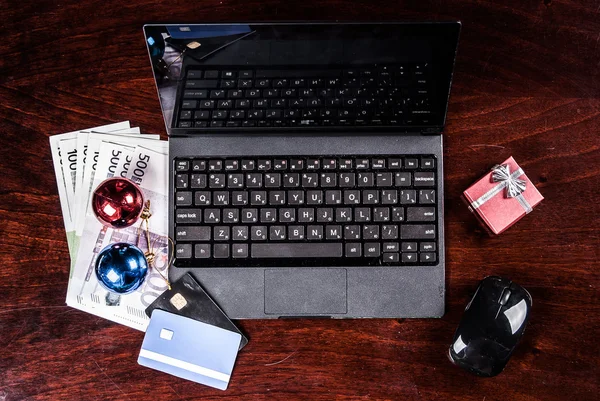 Black laptop on wood