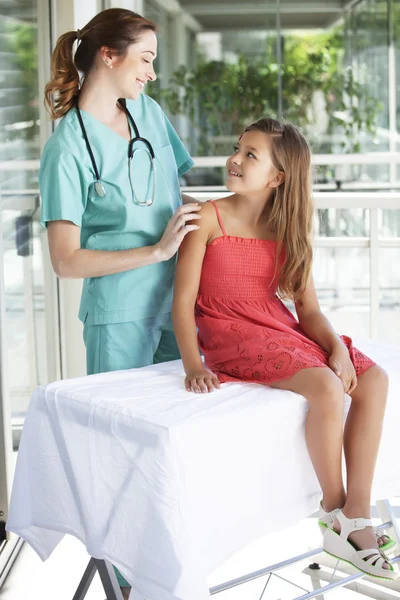 Pediatrician with her patient