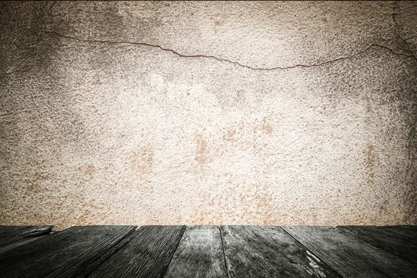 Grunge cement wall with wood floor, abstract pattern background.