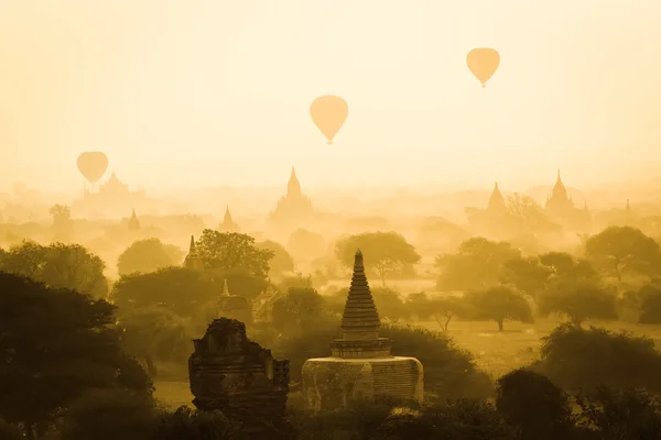 Hot air balloon over Bagan in misty morning, Myanmar