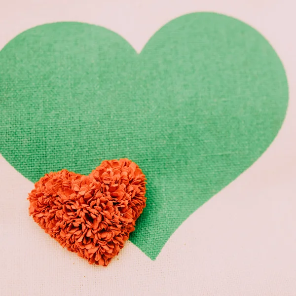 Red hearts and green heart white background.