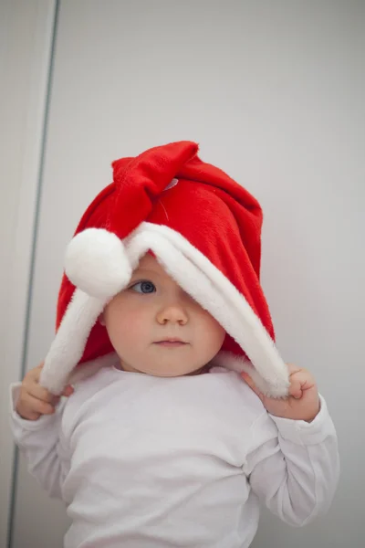 Little girl in red santa hat  portrait
