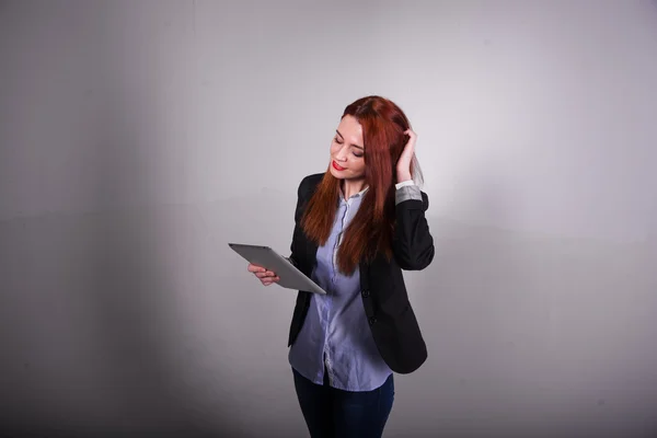 Red businesswoman showing tablet isolated over white