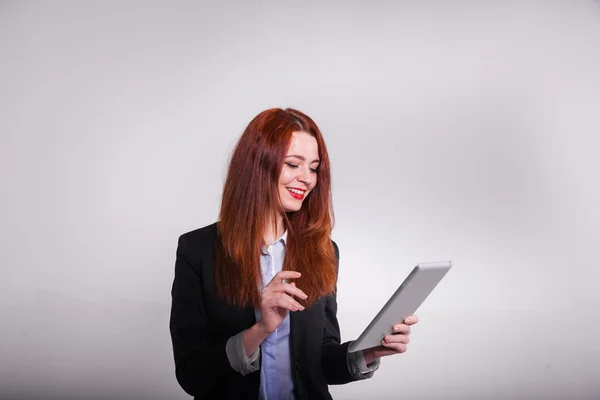 Red businesswoman showing tablet isolated over white