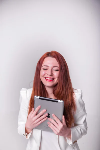 Red businesswoman holding tablet and showing thumbs up isolated over white