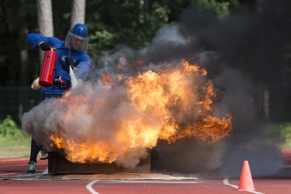 Fire Applied Sport firefighter puts out a fire extinguisher