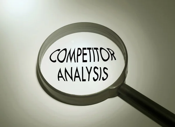 Magnifying glass with the word competitor analysis