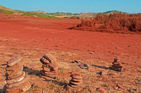 Menorca, Balearic Islands, Spain: the red sand and rocks on the path to Cala Pregonda beach